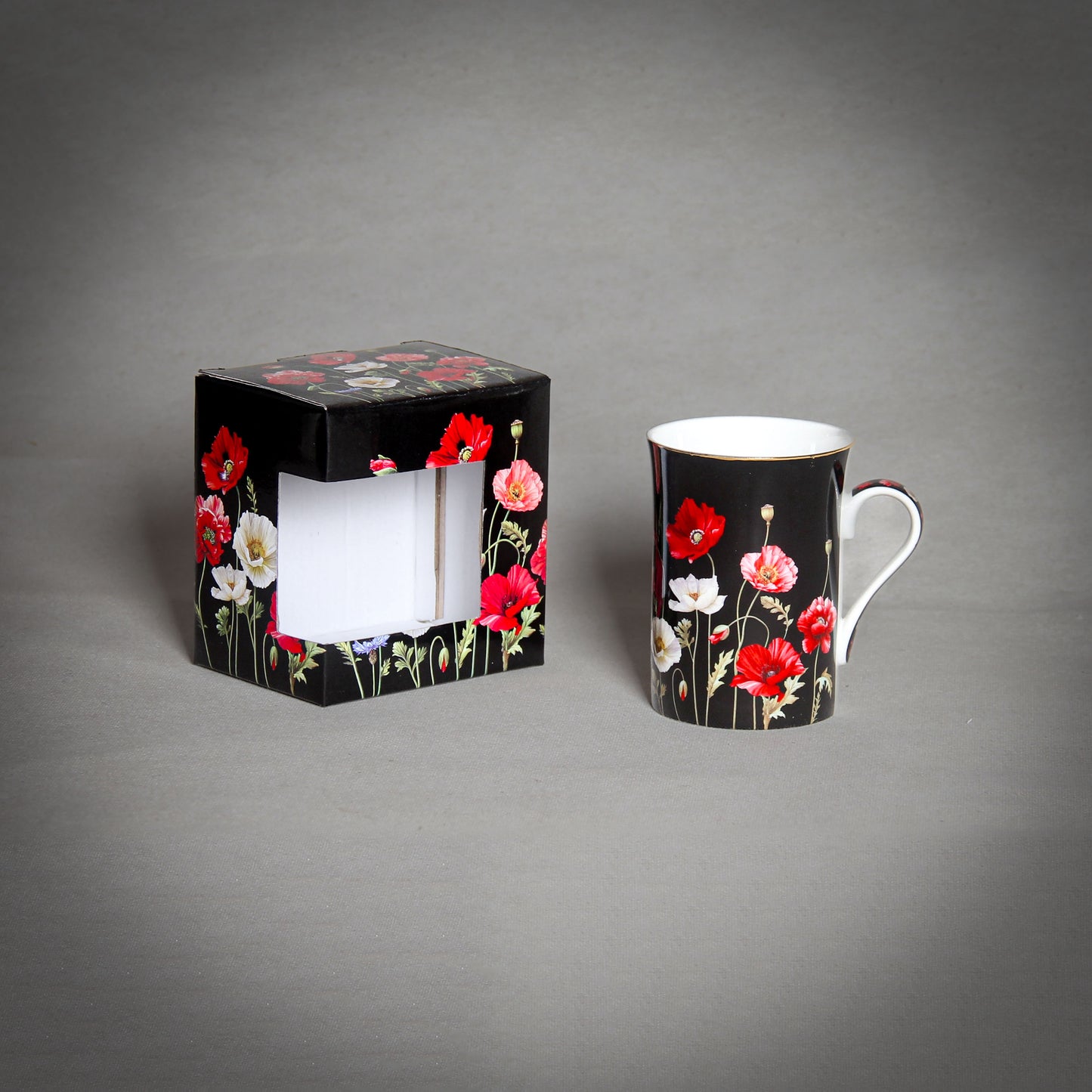 "The Poppy" Black Cup with a matching box on the grey background
