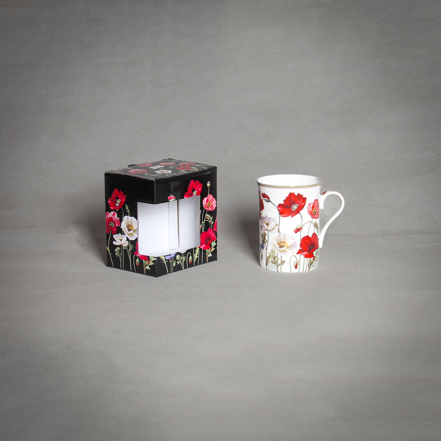 "The Poppy" Tea Cup and a decorative box on the grey background