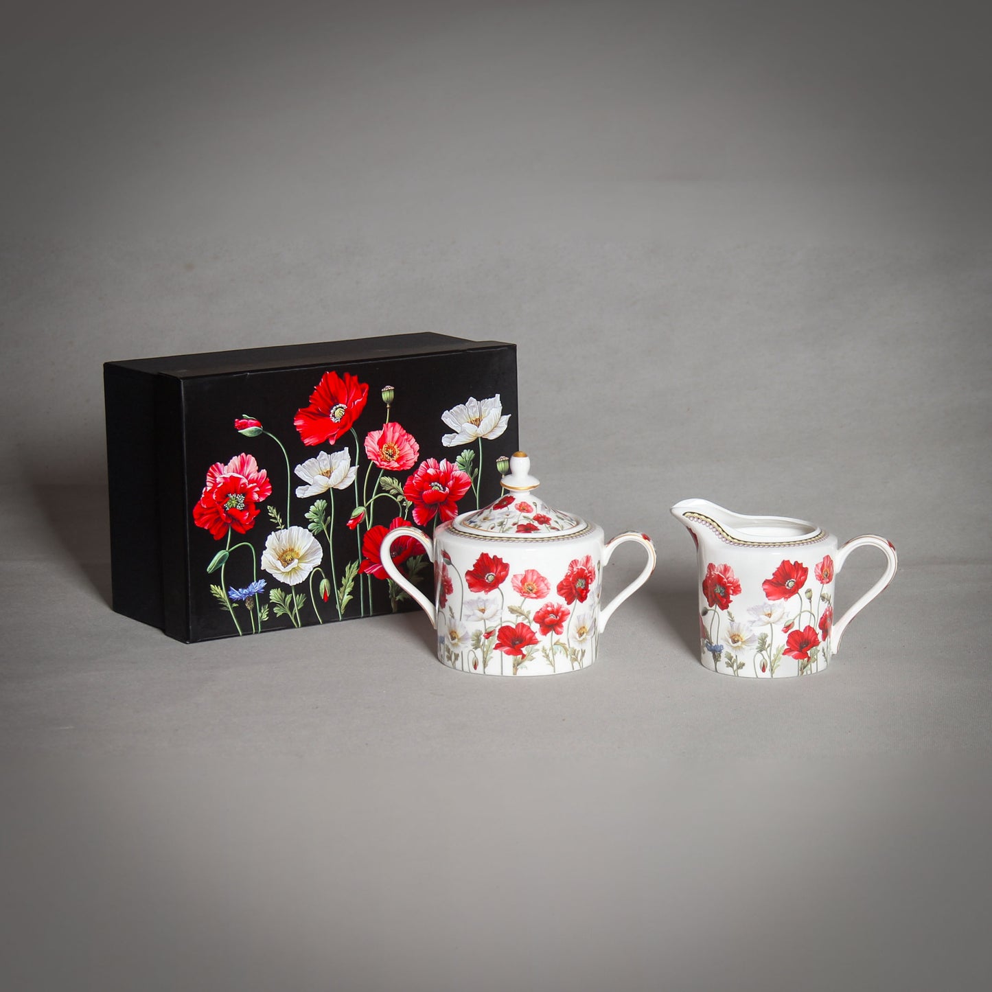 "The Poppy" White Sugar Bowl and Creamer and a black box with poppies on the grey background