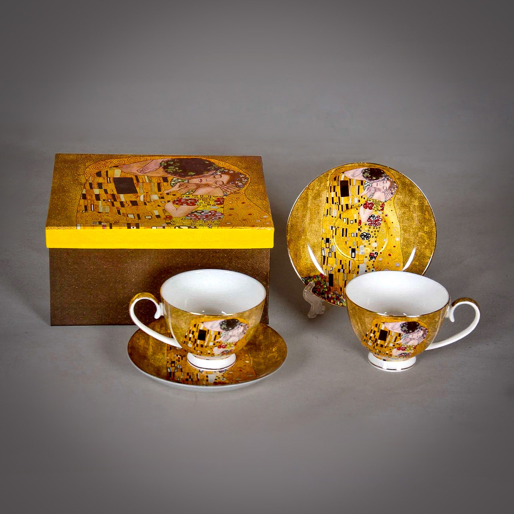 front and side view of Gustav Klimt The Kiss Cup and a matching Saucer on a grey background