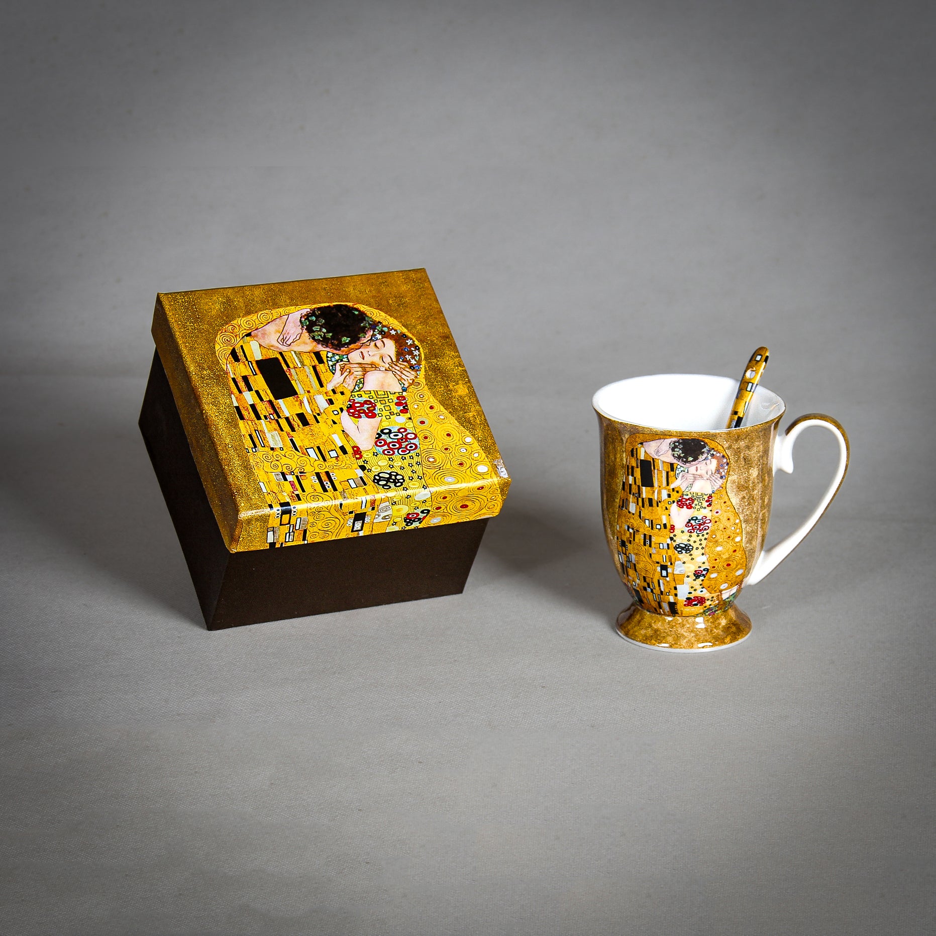Gustav Klimt "The Kiss" Golden Mug and Spoon on the grey background