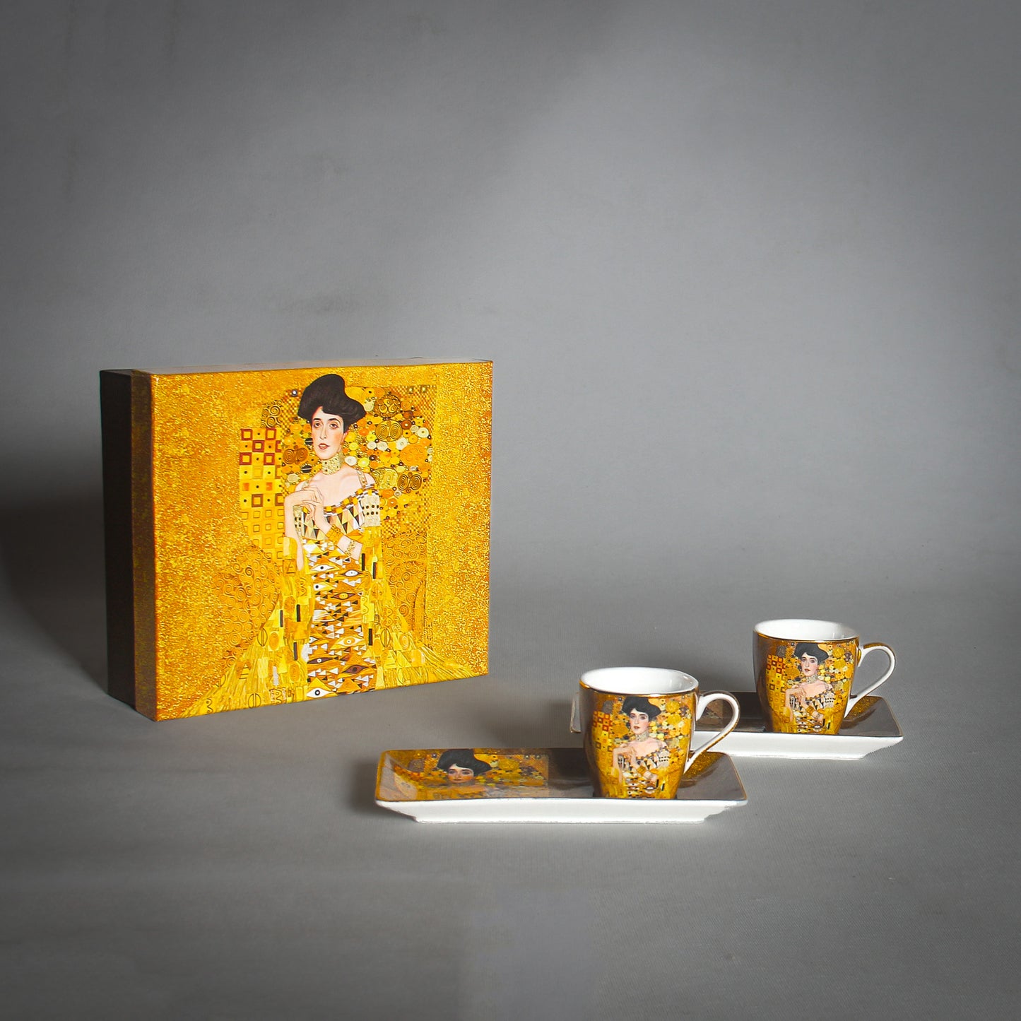 Gustav Klimt "The Lady" Golden Tea Set and a matching box on the grey background