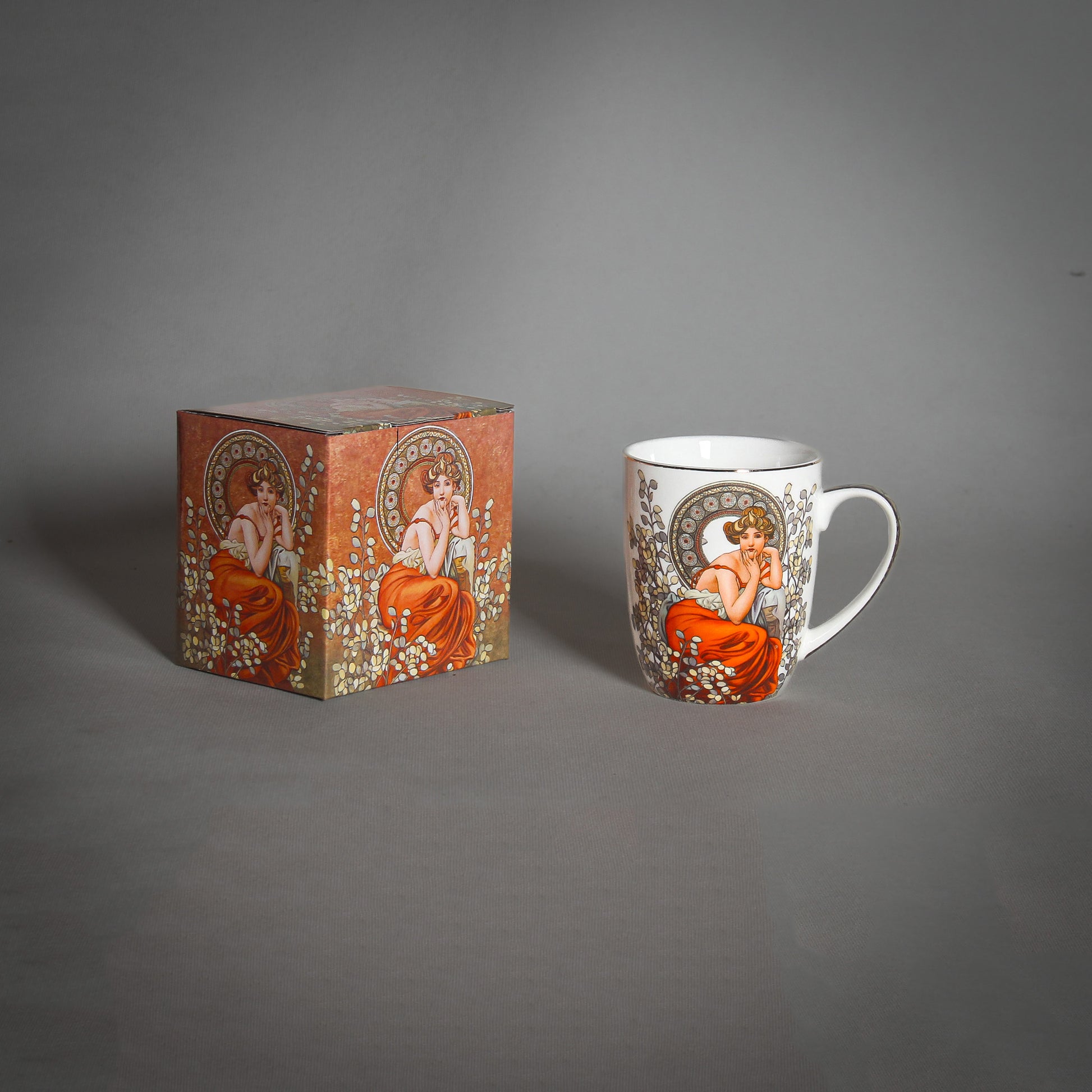 Mucha Mug and a decorative box on the grey background