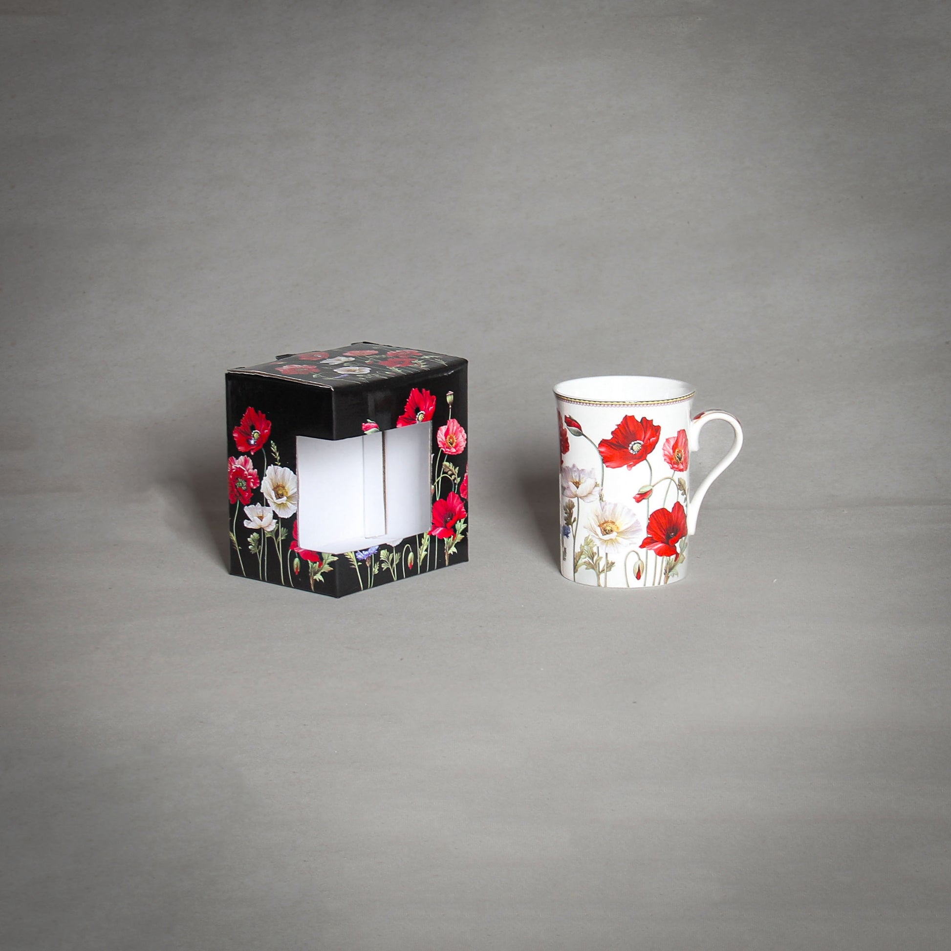 "The Poppy" Tea Cup and a decorative box on the grey background