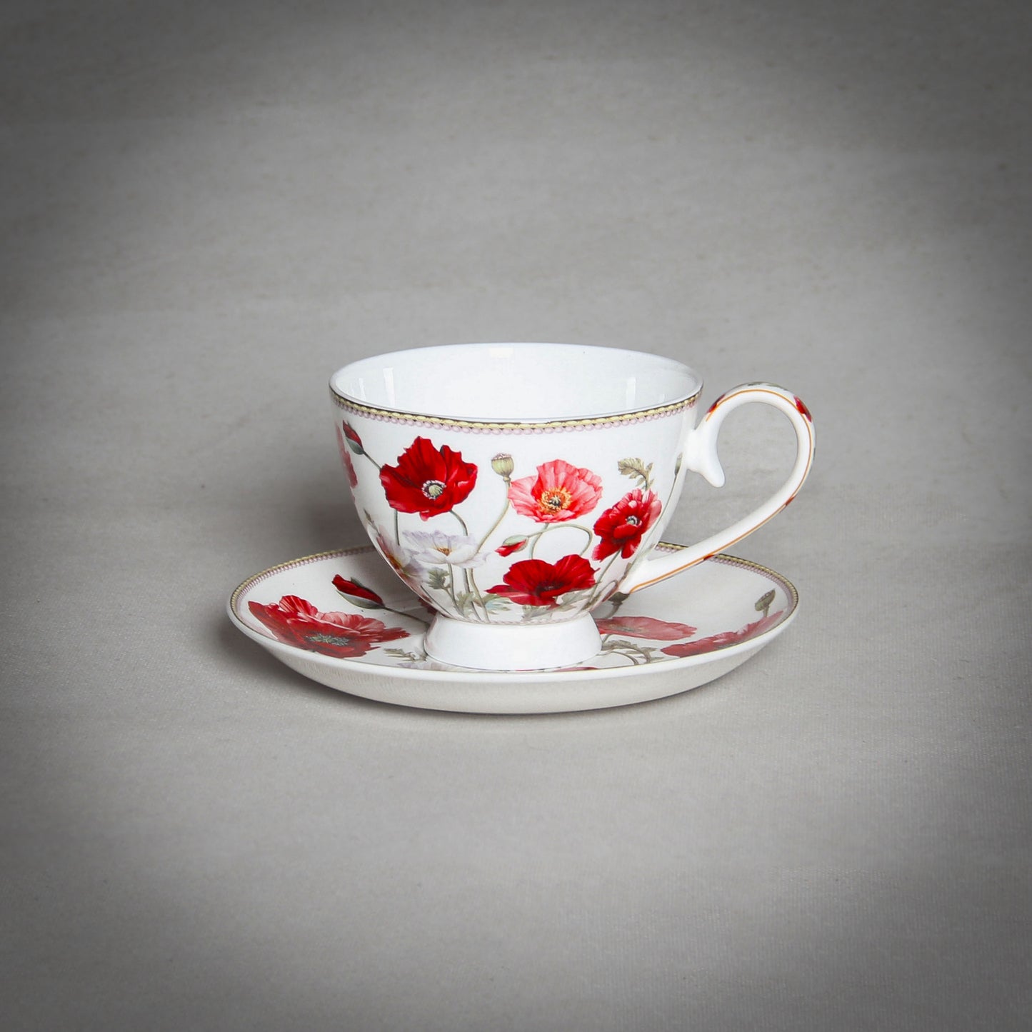 "The Poppy" White Cup on the grey background