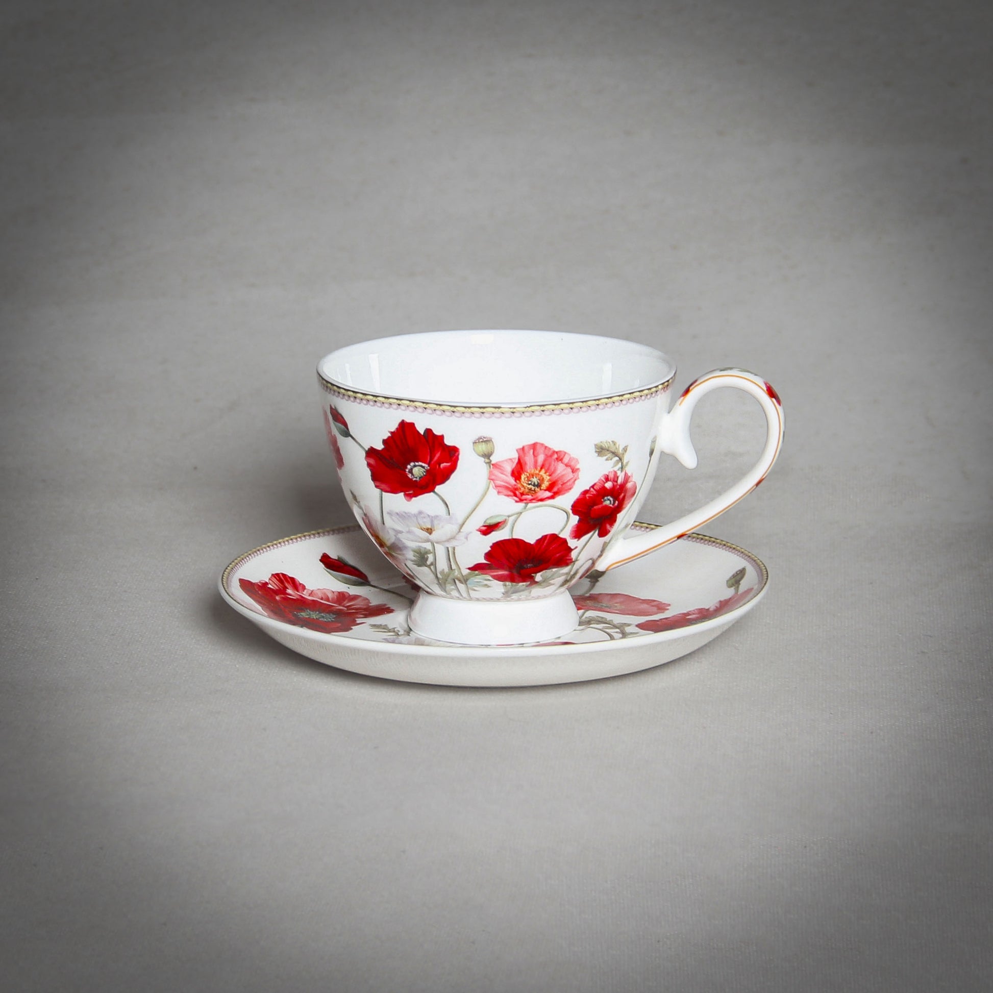"The Poppy" White Cup on the grey background