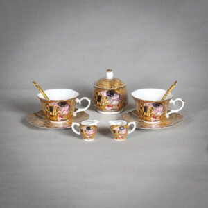 Gold porcelain tea set with Klimt The Kiss design, including cups, saucers, sugar bowl, and creamers